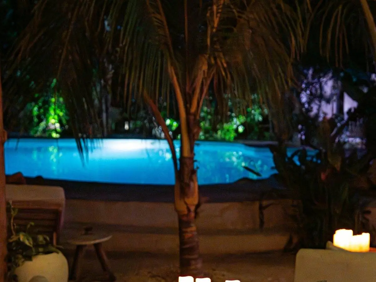 Candlelit poolside tables under the stars at The Pavilion, Seconda Stella